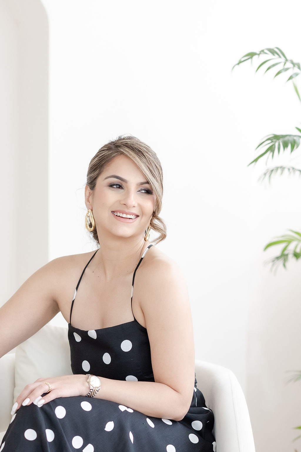 Nishka Rangwani smiling in a polka-dot dress